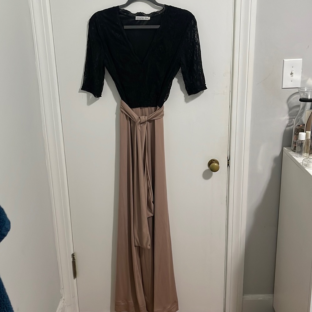 Large, formal dress, black lace on top.